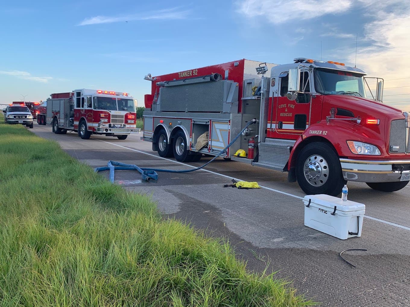 Cove Fire & Rescue Tanker 92 and fire apparatus staged during a daytime response, with department branding visible on the vehicles.